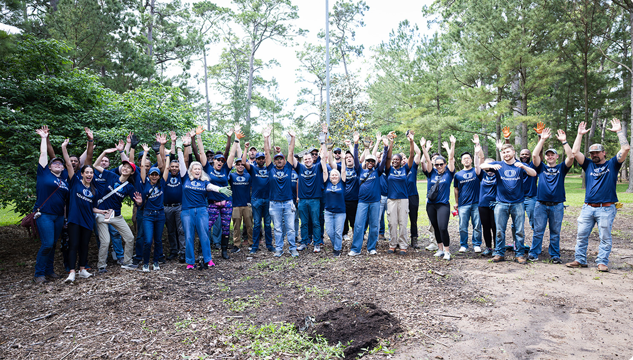 Boardwalk employees volunteering together outdoors